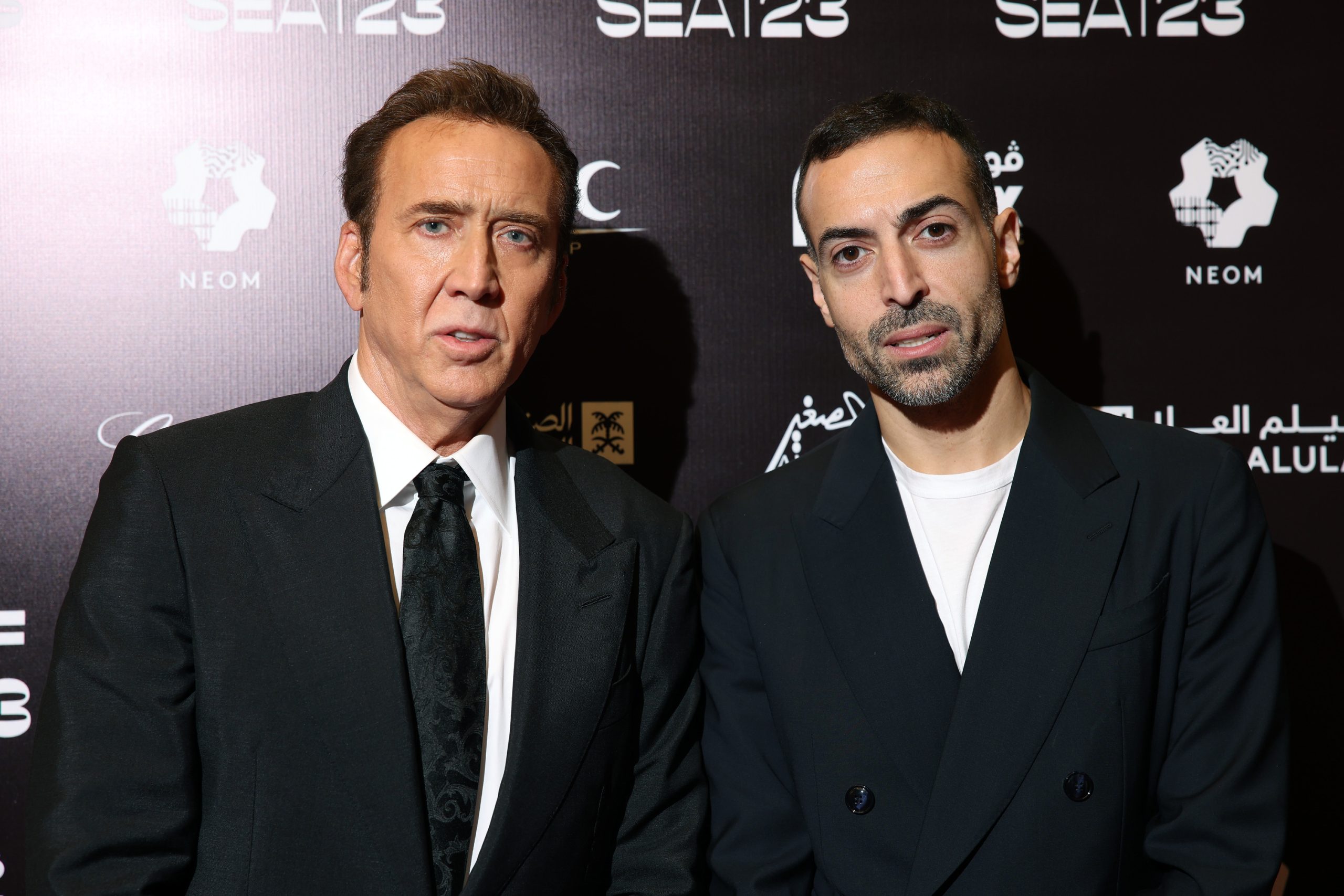 JEDDAH, SAUDI ARABIA - DECEMBER 07: Nicolas Cage and CEO of the Red Sea International Film Festival, Mohammed Al Turki pose during a photocall ahead of the In Conversation With Nicolas Cage during the Red Sea International Film Festival 2023 on December 07, 2023 in Jeddah, Saudi Arabia. (Photo by Daniele Venturelli/Getty Images for The Red Sea International Film Festival)