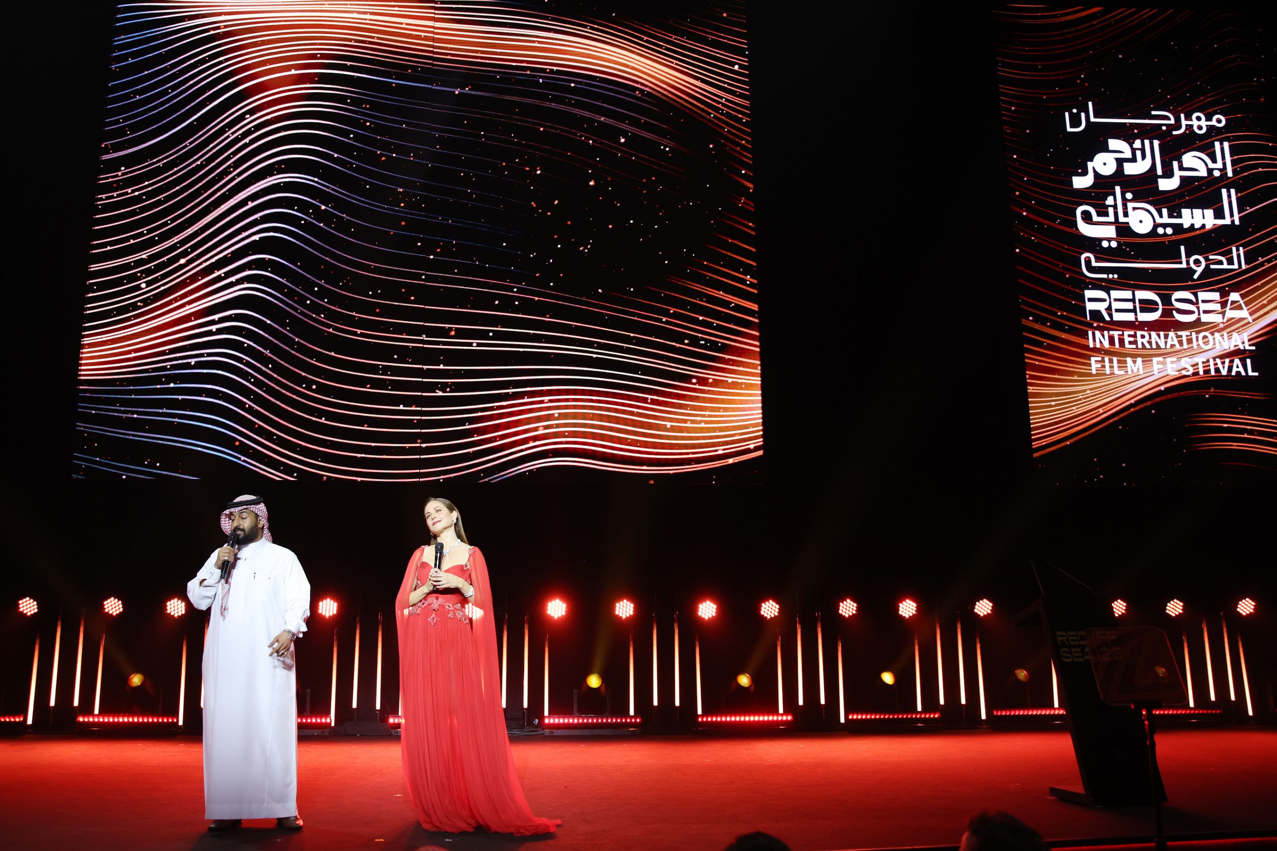 JEDDAH, SAUDI ARABIA - DECEMBER 07: Mohammed Al Dokhei and Raya Abirached speak on stage during the Closing Ceremony at the Red Sea International Film Festival 2023 on December 07, 2023 in Jeddah, Saudi Arabia. (Photo by Daniele Venturelli/Getty Images for The Red Sea International Film Festival)